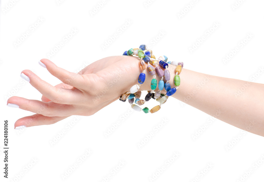 Beads colorful stones bracelet in hand on a white background isolation