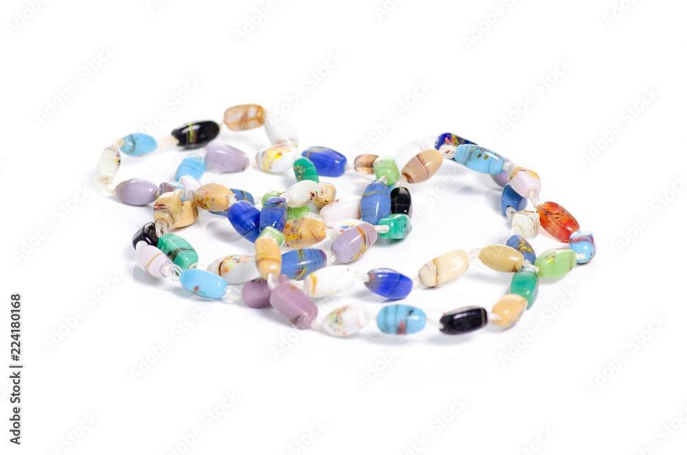 Beads colorful stones on a white background isolation Beads colorful stones on a white background isolation