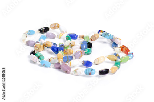 Beads colorful stones on a white background isolation
