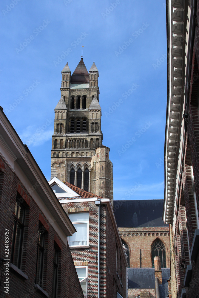 View of the tower of Saint-Salvator Cathedral on a sunny day. Bruges, Belgium.