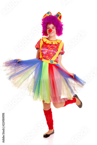 Happy young clown girl on white background