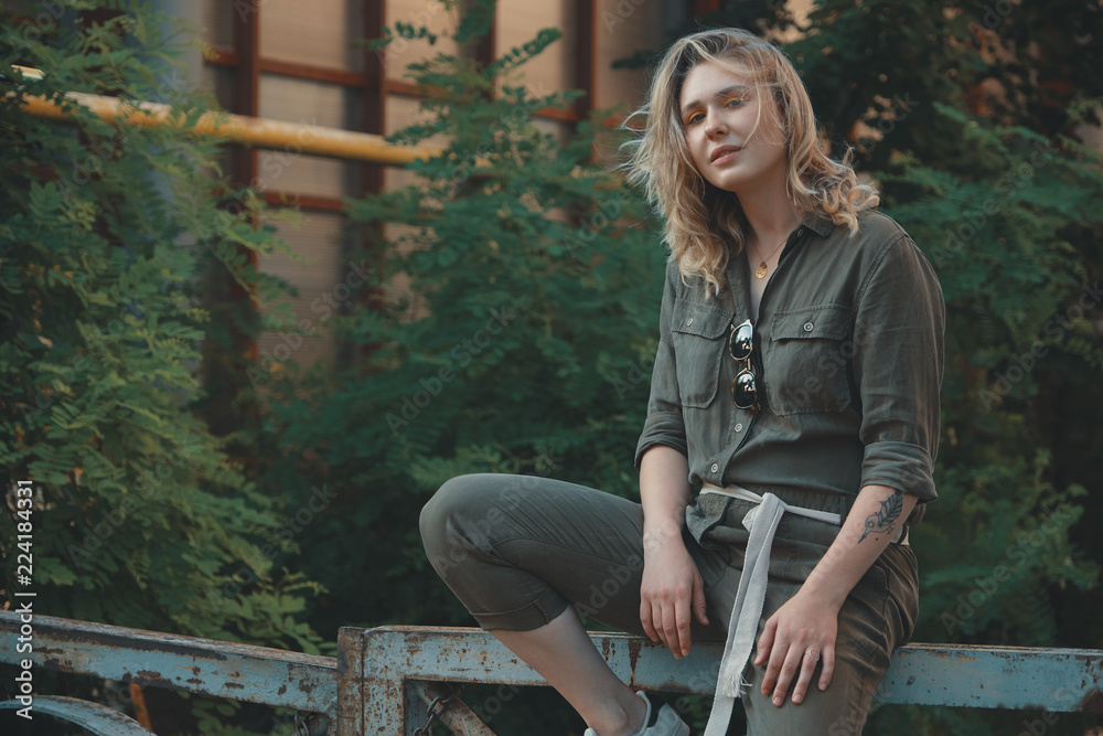 Outdoor lifestyle portrait of carefree urban girl