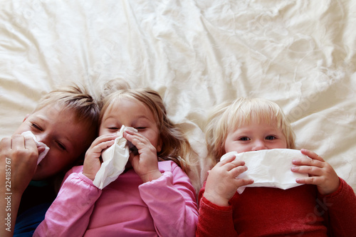 Canvas Print kids wiping and blowing nose, infection or allergy