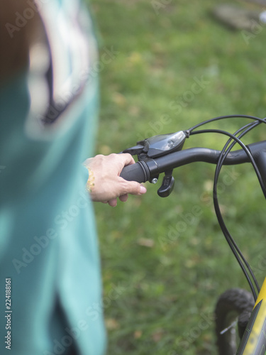 Girl holding a Bicycle handlebar