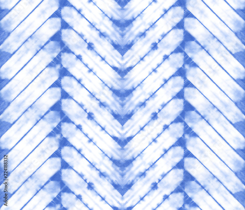 Seamless pattern, abstract tie dyed fabric of indigo color on white cotton. Hand painted fabrics. Shibori dyeing