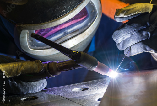 Metal welding process that uses a non-consumable tungsten electrode. Close-up.