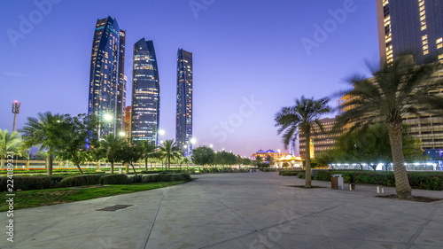 Skyscrapers of Abu Dhabi with Etihad Towers buildings day to night timelapse. © neiezhmakov