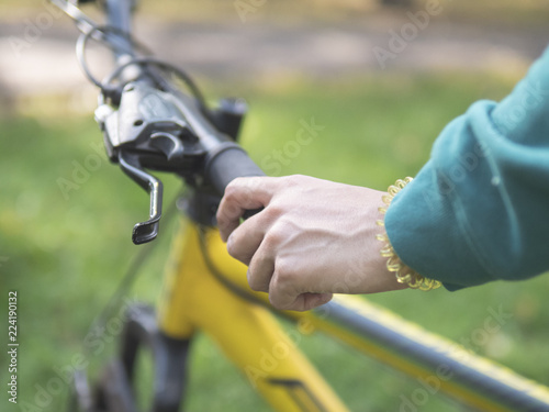 Young woman riding a bike in the summertime