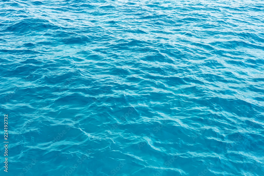 surface blue sea water. Texture of water with small waves. surface blue sea water. Texture of water with small waves.