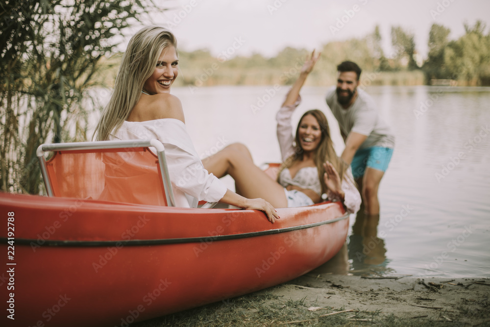 Obraz premium Young people having fun by river