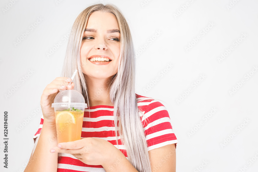 Health, people, food, sports, lifestyle and beauty content - Smiling Young Woman with glass of Water with lemon Health, people, food, sports, lifestyle and beauty content - Smiling Young Woman with glass of Water with lemon