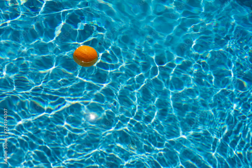 bright orange on blurry water background
