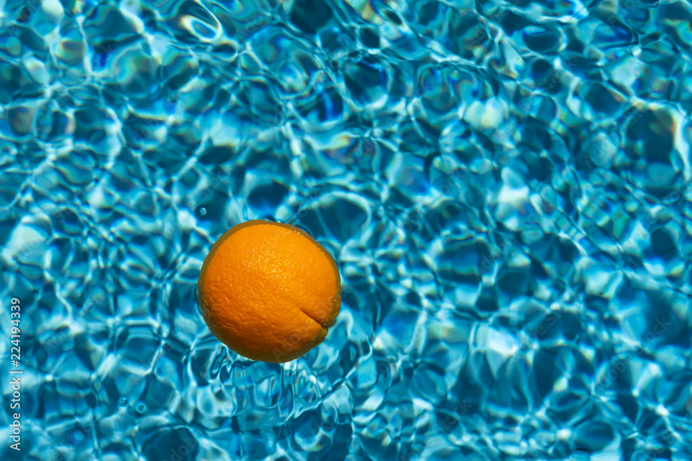bright orange on blurry water background
