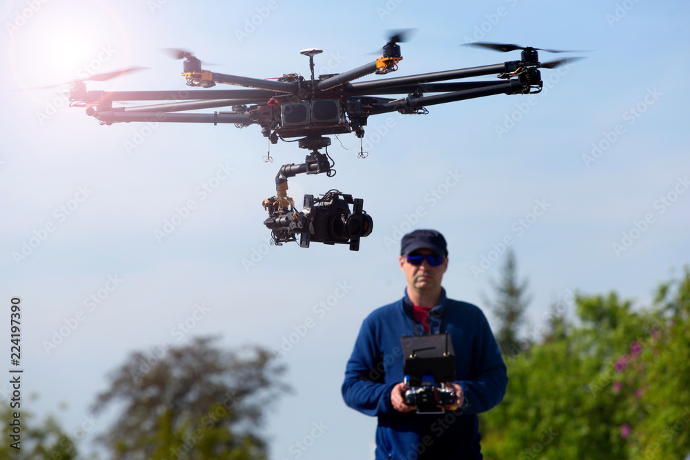 Drone,  pilot flying drone  - obrazy, fototapety, plakaty 