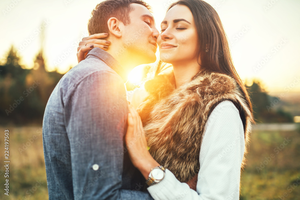 Happy couple in love relaxing in the field. Happy couple in love relaxing in the field.