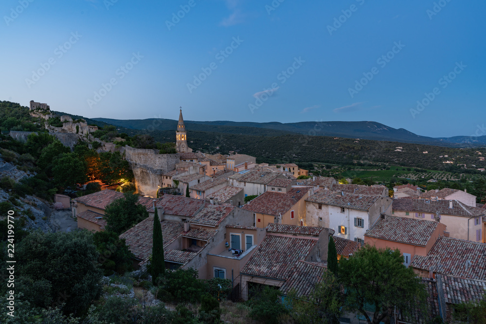 The medieval town Saint-Saturnin seen from above at nightfall, Provence, France