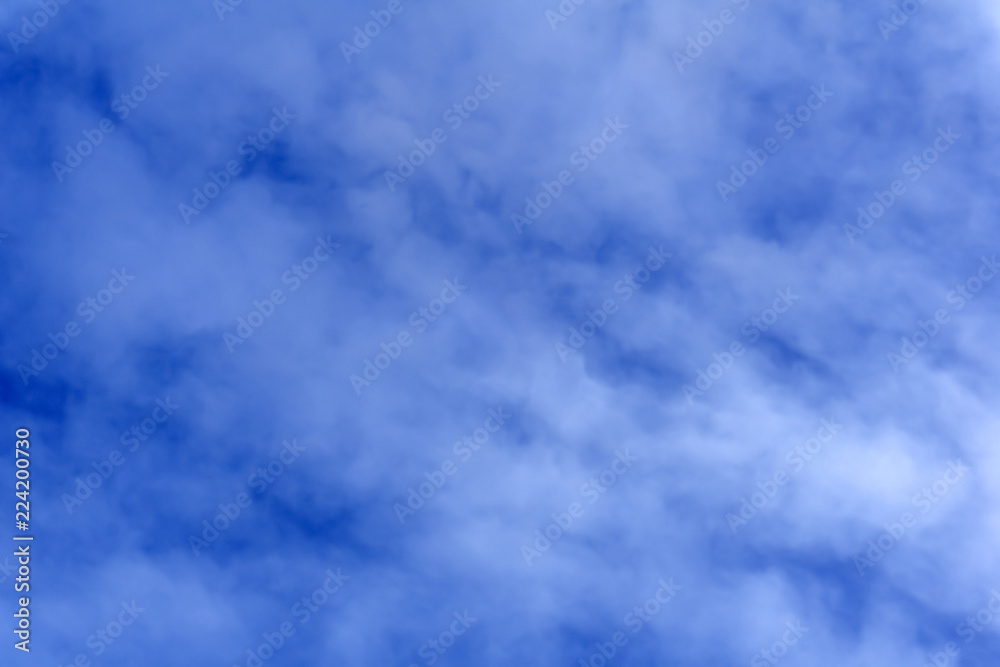 Obraz premium celestial background - blue day sky with white cirro-cumulus clouds..