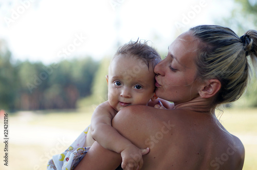 Happy mother and son in the forest