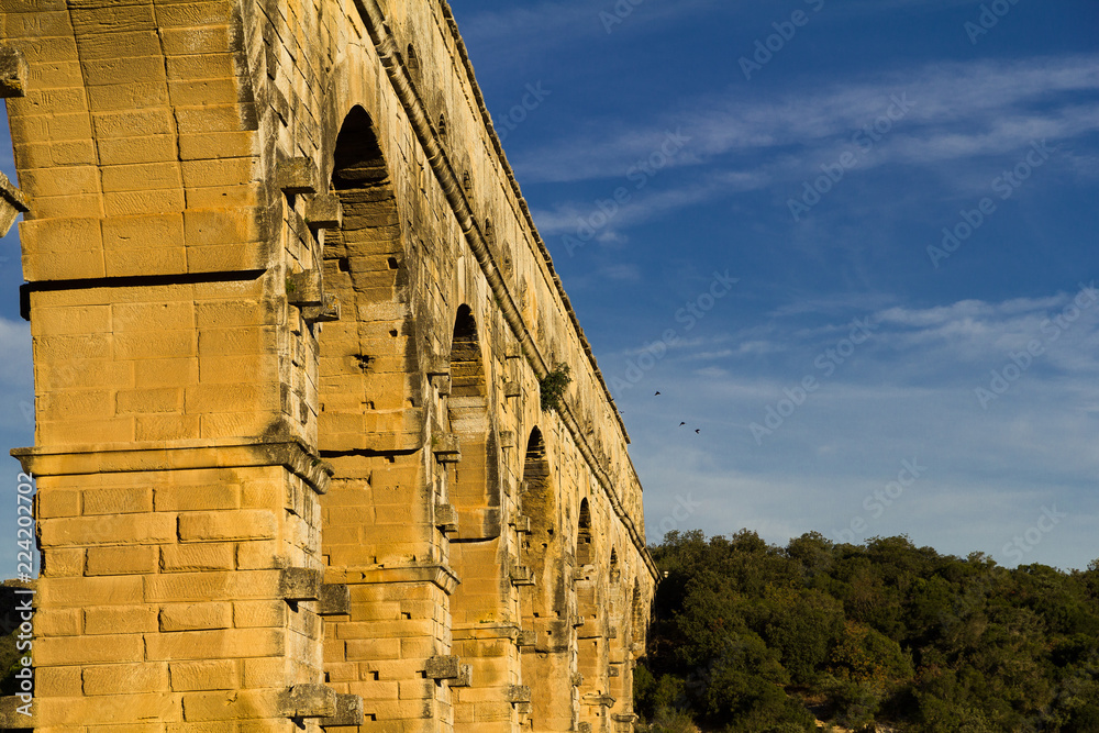 Fototapeta premium The Pont du Gard, an ancient Roman aqueduct, crossing the river Gardon in Southern France