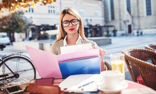 Business woman on coffee break in a cafe. Business, education, lifestyle concept