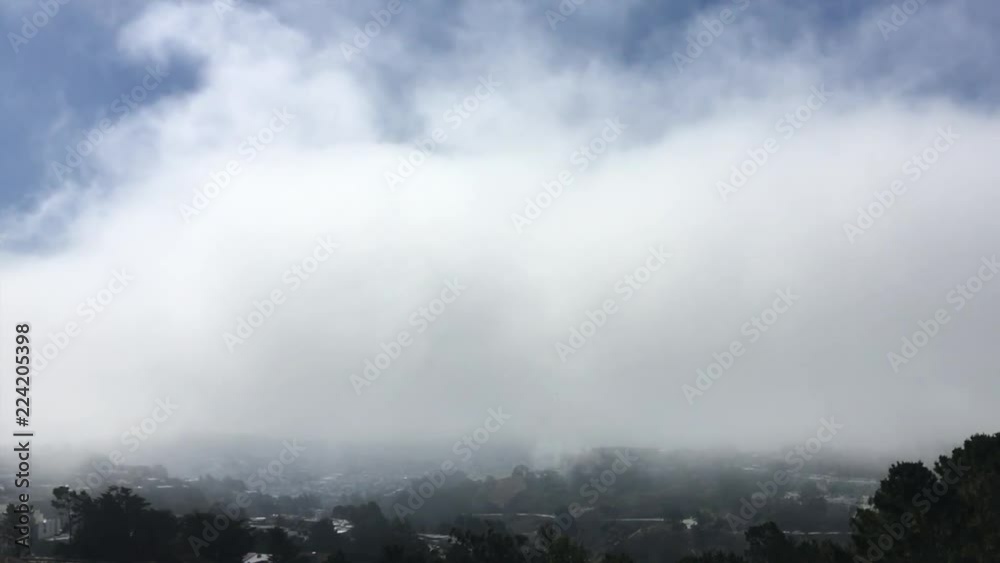 Thick fog blowing through the sky in San Francisco, California Thick fog blowing through the sky in San Francisco, California