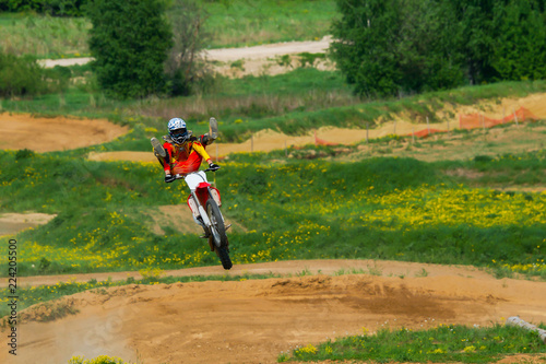 Fototapeta Naklejka Na Ścianę i Meble -  Motocross rider in the action