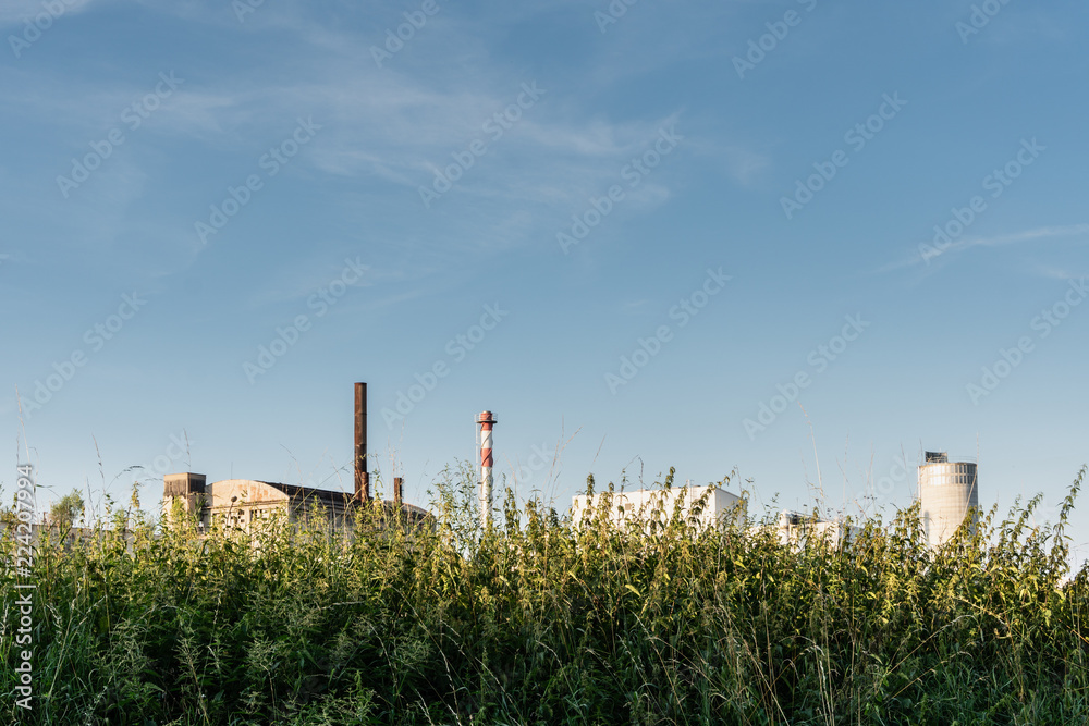 Industrial buildings behind the grass in Banska Bystrica, Slovakia