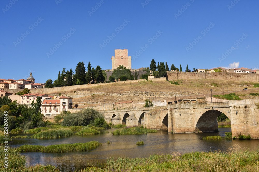 view of bridge and the Castle of Henry II of Castile (14th century) and River Agueda, Ciudad Rodrigo, Castile and Leon, Spain
