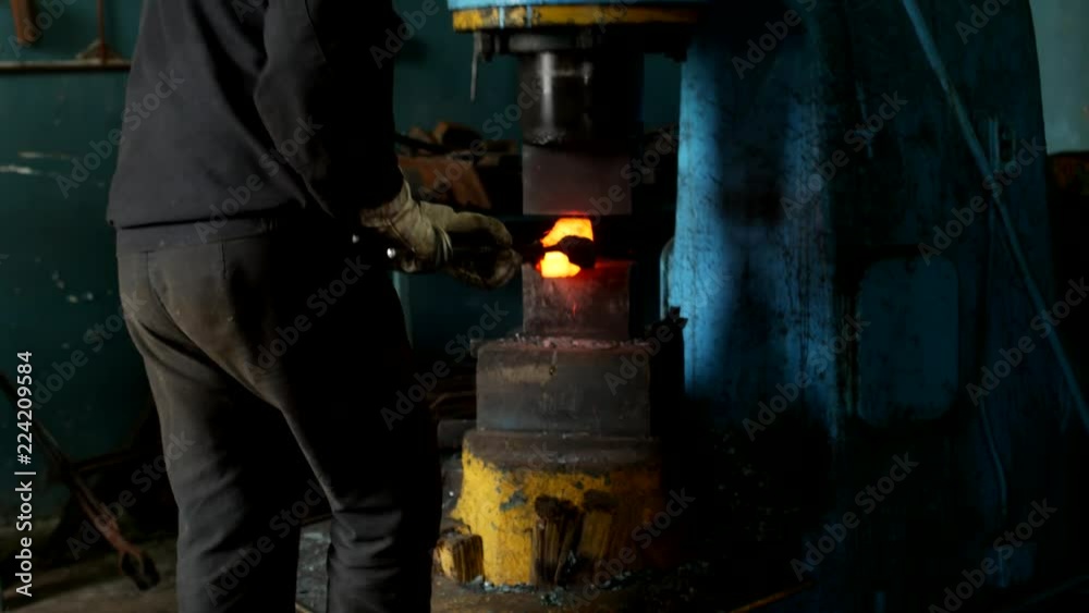 An old smithy, a blacksmith forging a metal part for engineering, a hot metal, a close-up, metalwork