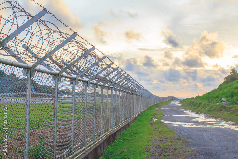 wire mesh steel with green grass background in Phuket Thailand