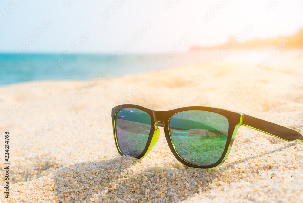 Sunglasses on the sandy coast