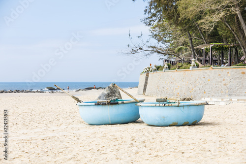 Pair of round boats on a beach in Vietnam