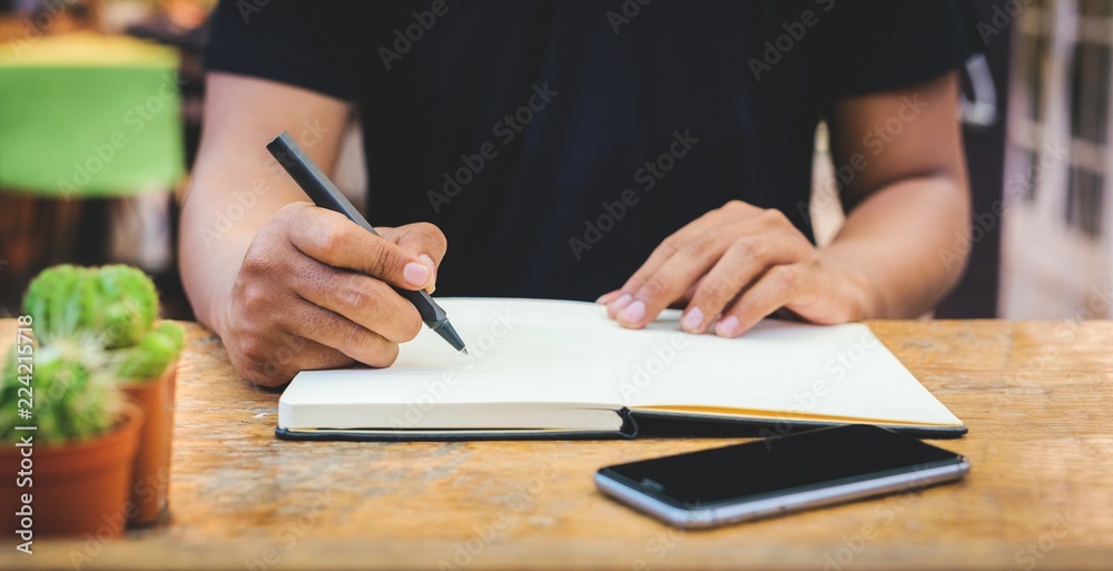 Close up hand man are writing notepad