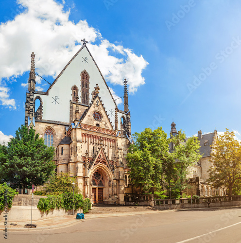 Panoramic view of Architecture and Facade of St. Thomas Church Thomaskirche in Leipzig, Germany. Travel tourist and religious destination in Europe
