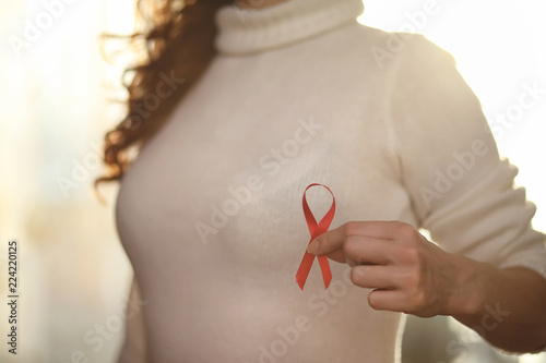 Wallpaper Mural The red ribbon of the girl. The girl is holding a red ribbon. He Torontodigital.ca