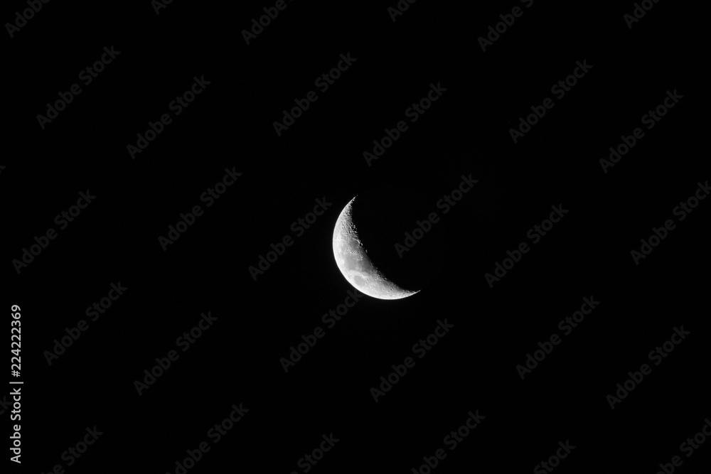 Big crescent moon in black sky Big crescent moon in black sky