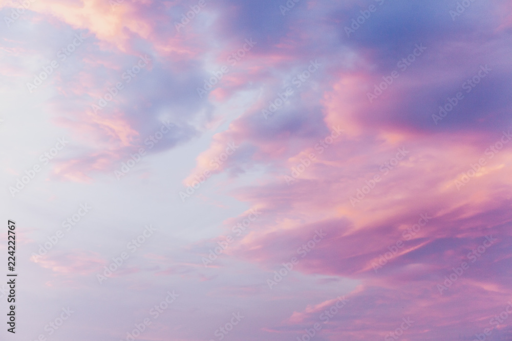 Pink clouds on blue sunset sky