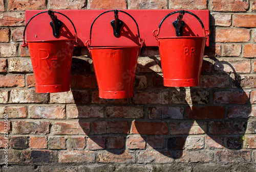 Three red fire buckets, Levisham Railway Station, Ryedale, North Yorkshire Moors photo