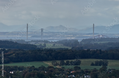 A photograph of the bridges over the Firth of Forth and rolling hills of the Midlothian Countryside near Edinburgh.