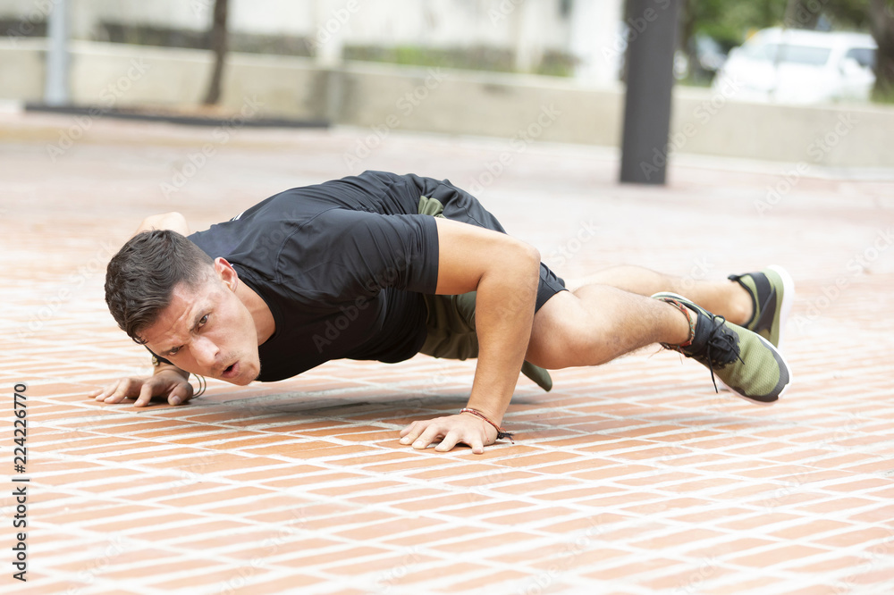 Fototapeta premium Man doing fitness in outdoor park