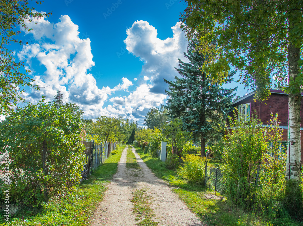 Bright white clouds on the blu sky bavkground in the subutban village. Sunny bright day with white clouds.