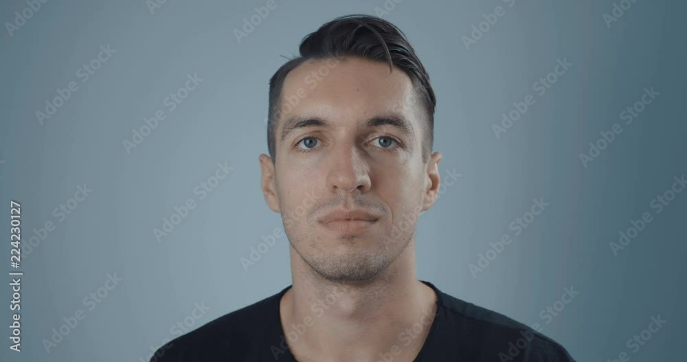 portrait of young man on a neutral background portrait of young man on a neutral background