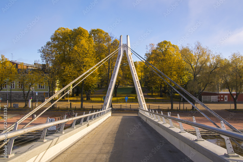 Pedestrian bridge over the river Porvoonjoki and view to The Runeberg Park, Porvoo, Finland