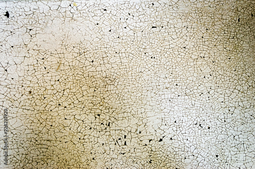 Textured background of stained cracked white painted surface Textured background of stained cracked white painted surface