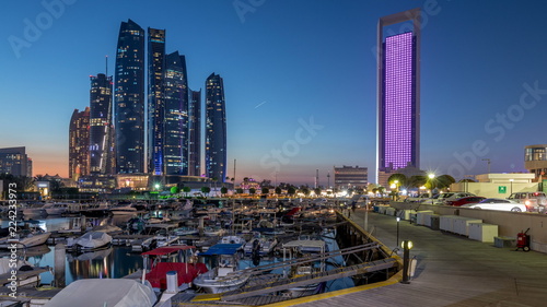 Al Bateen marina Abu Dhabi day to night timelapse with modern skyscrapers on background
