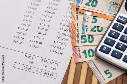 Purchasing order with euro banknotes and calculator