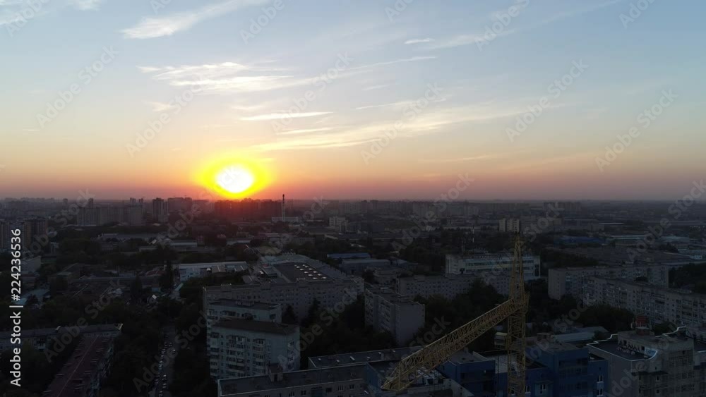 Aerial: building crane on sunset background Aerial: building crane on sunset background