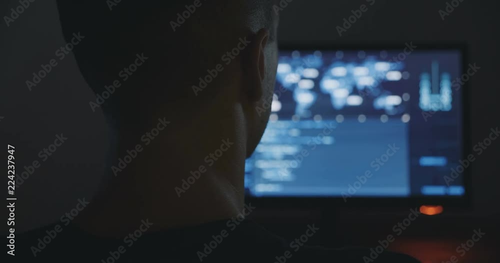 Hacker is working in dark room Hacker is working in dark room