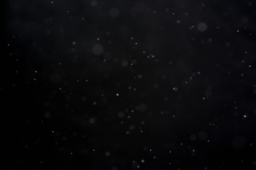 Snowfall on black background - design element. Abstract black white snow texture on black background for overlay