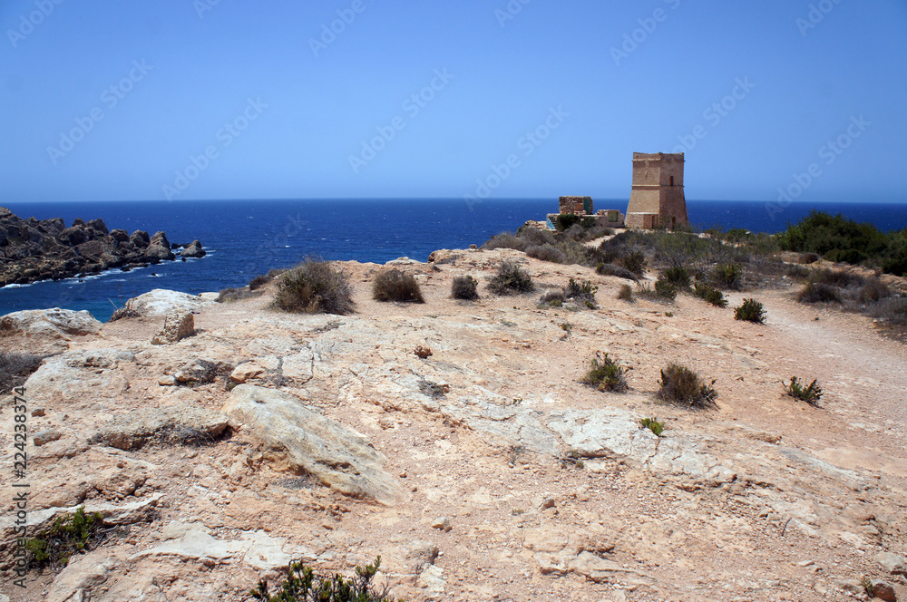 Panorama with Ghajn Tuffieha (Għajn Tuffieħa) Tower on the cliff next to the harbor,Golden Bay, Malta